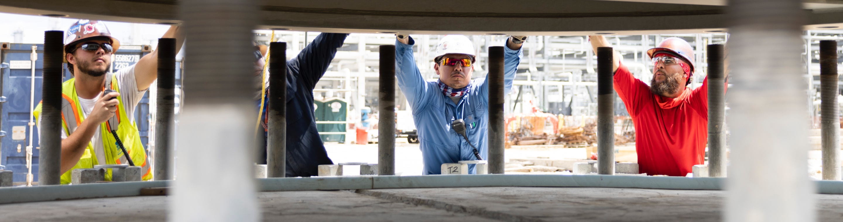 Industrial employees install equipment